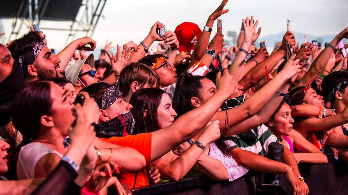 April 14, 2019, file photo, festival-goers attend the Coachella Music & Arts Festival at the Empire Polo Club in Indio, Calif.