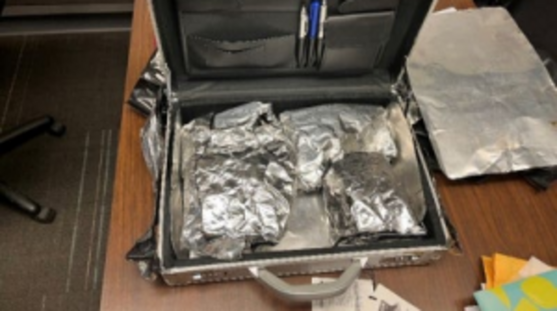 Youngstown felon for checking luggage containing concealed firearms, ammunition