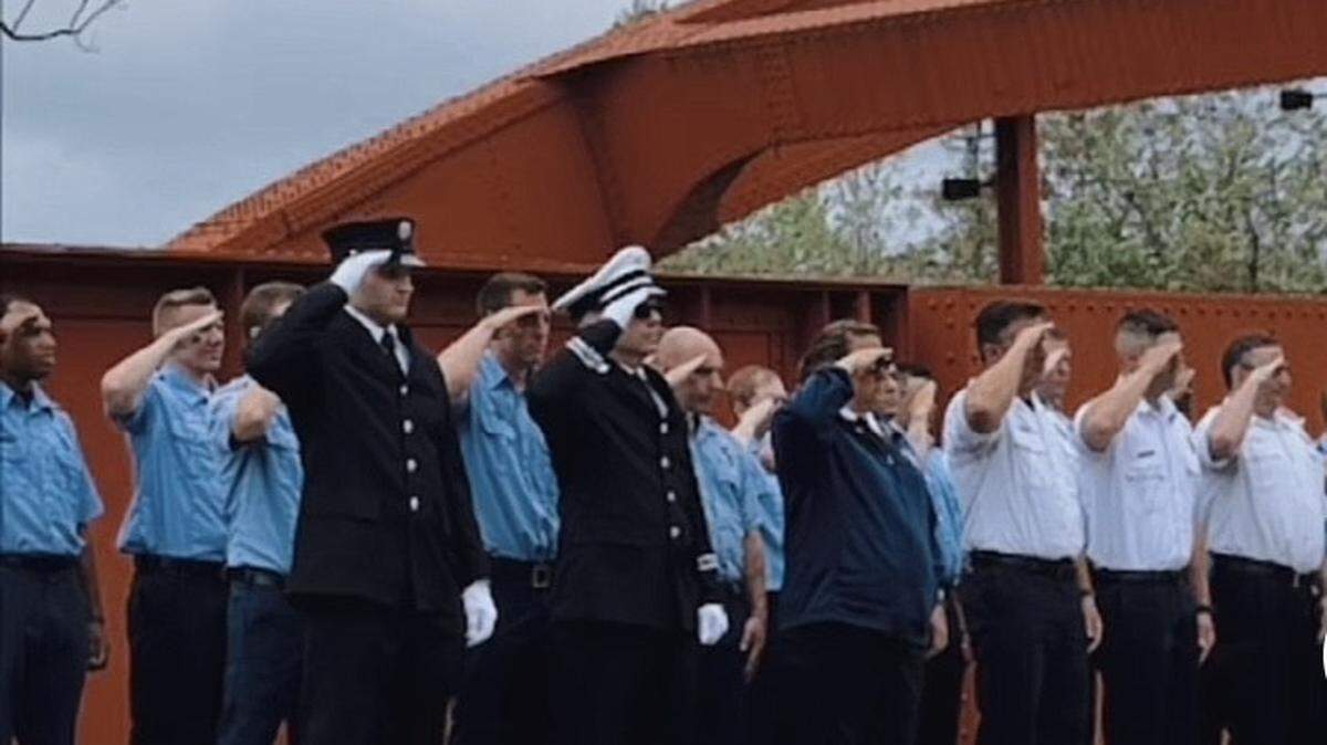 Youngstown firefighters met on the Spring Commons Bridge across from the fire station to honor their fallen colleagues.