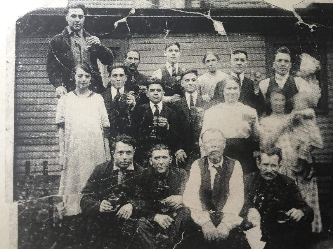 An old photograph of the Finamore and Donofrio family hangs on the wall at YOSTERIA, owned by Alex Zordich and Frank Tuscano. The families settled in Smoky Hollow from Italy and are cousins of Zordich.
