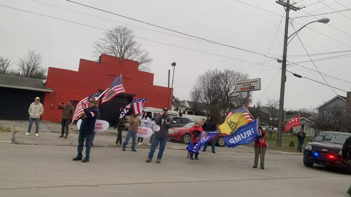 Protesters share their view as President Biden’s motorcade drove by.on the way to East Palestine.
