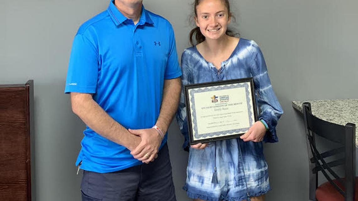 South Range cross country runner Emily Razo receives the Fellowship of Christian Athletes Steel Valley's Student-Athlete of the Month honor from Bob Kimpel.