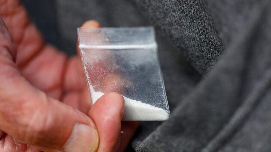 fentanyl opiate in plastic bag in hand close-up