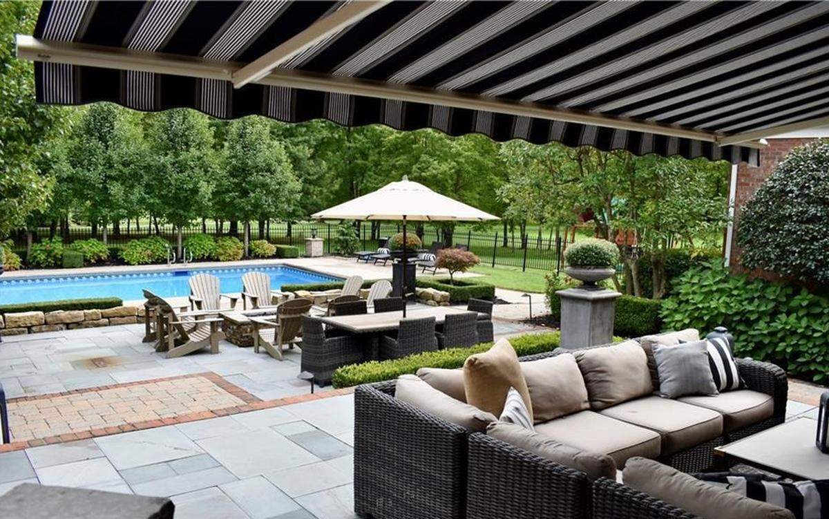 You’ll want to move into this home on Windemere Place with its four bedrooms, five bathrooms, and swimming pool out back.