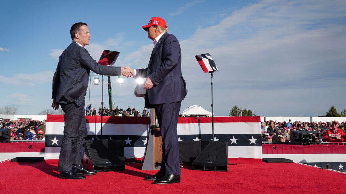 Republican presidential candidate former President Donald Trump greets Ohio Republican candidate for US Senate Bernie Moreno during a rally at the Dayton International Airport on March 16, 2024 in Vandalia, Ohio. The rally was hosted by the Buckeye Values PAC.