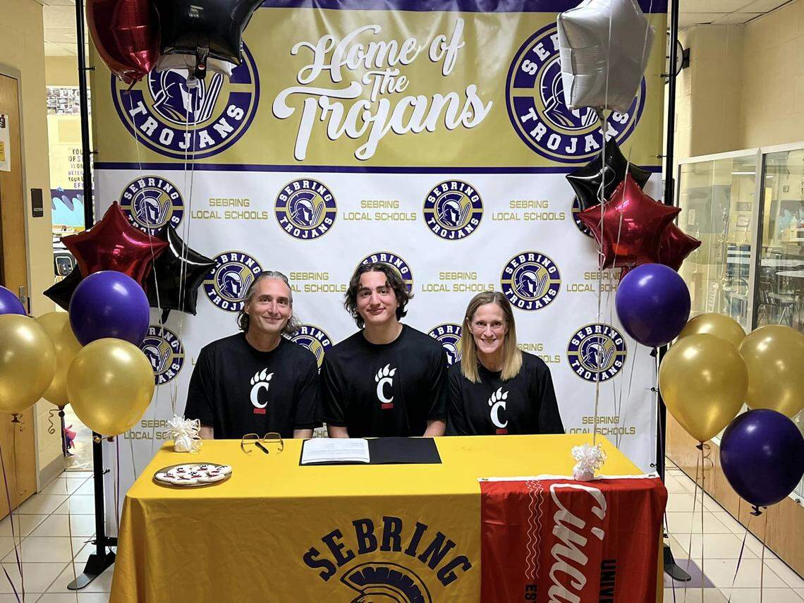 Senior Johnathon Billingsley recently committed to the University of Cincinnati on a cheerleading scholarship with his parents Kyle and Becky Billingsley supporting him.