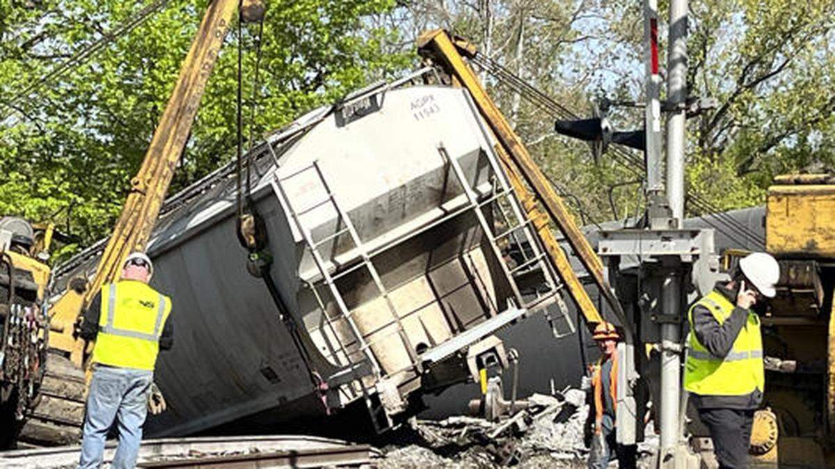 Recovery work is shown at the scene of a train derailment outside New Castle, Pa., on Thursday, May 11, 2023. Officials say nine railcars from a Norfolk Southern freight train derailed in Pennsylvania, with no hazardous chemicals on board and no reported injuries