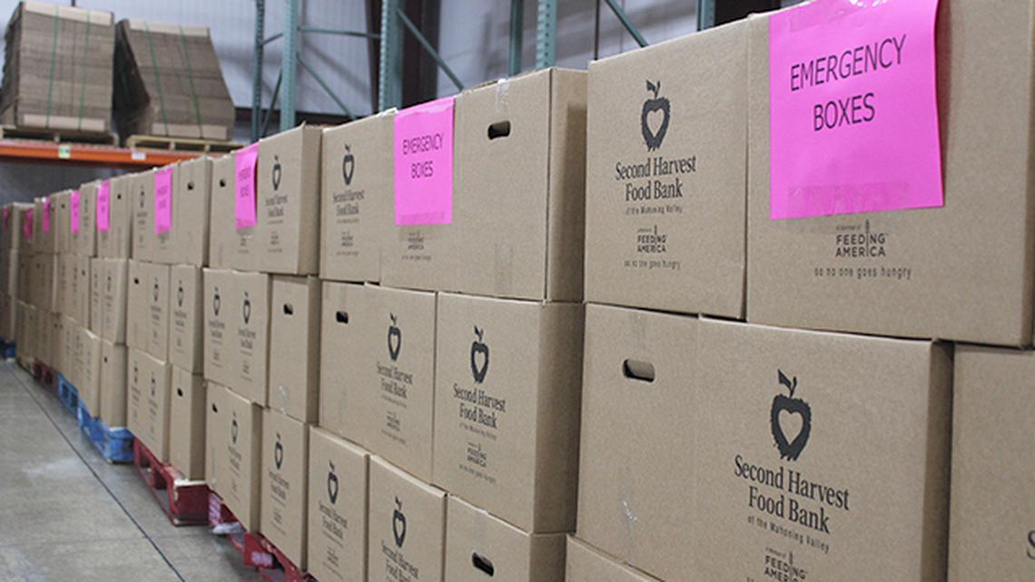 Second Harvest Food Bank of the Mahoning Valley workers on Monday lined a storeroom at the Youngstown facility with "emergency boxes" during an outbreak of new coronavirus, or COVID-19 in the state. (Photo by Justin Dennis | Mahoning Matters)