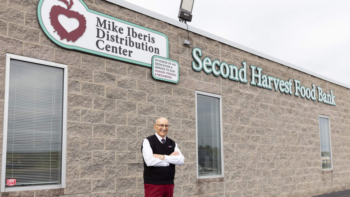 Mike Iberis stands outside the newly-renamed Mike Iberis Distribution Center, celebrating his 25th year working for Second Harvest Food Bank of the Mahoning Valley.