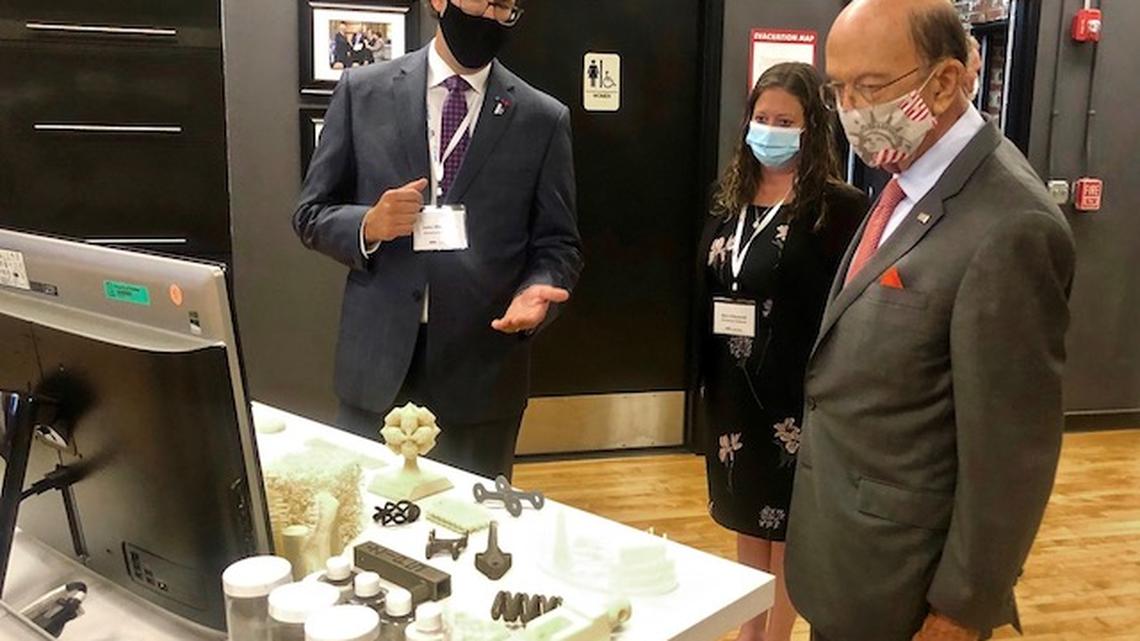 America Makes Executive Director John Wilczynski, left,  and Partnerships &amp; Community Relations Director Erin O'Donnell give U.S. Secretary of Commerce Wilbur Ross a tour of the facility Wednesday afternoon. (Jess Hardin/Mahoning Matters)