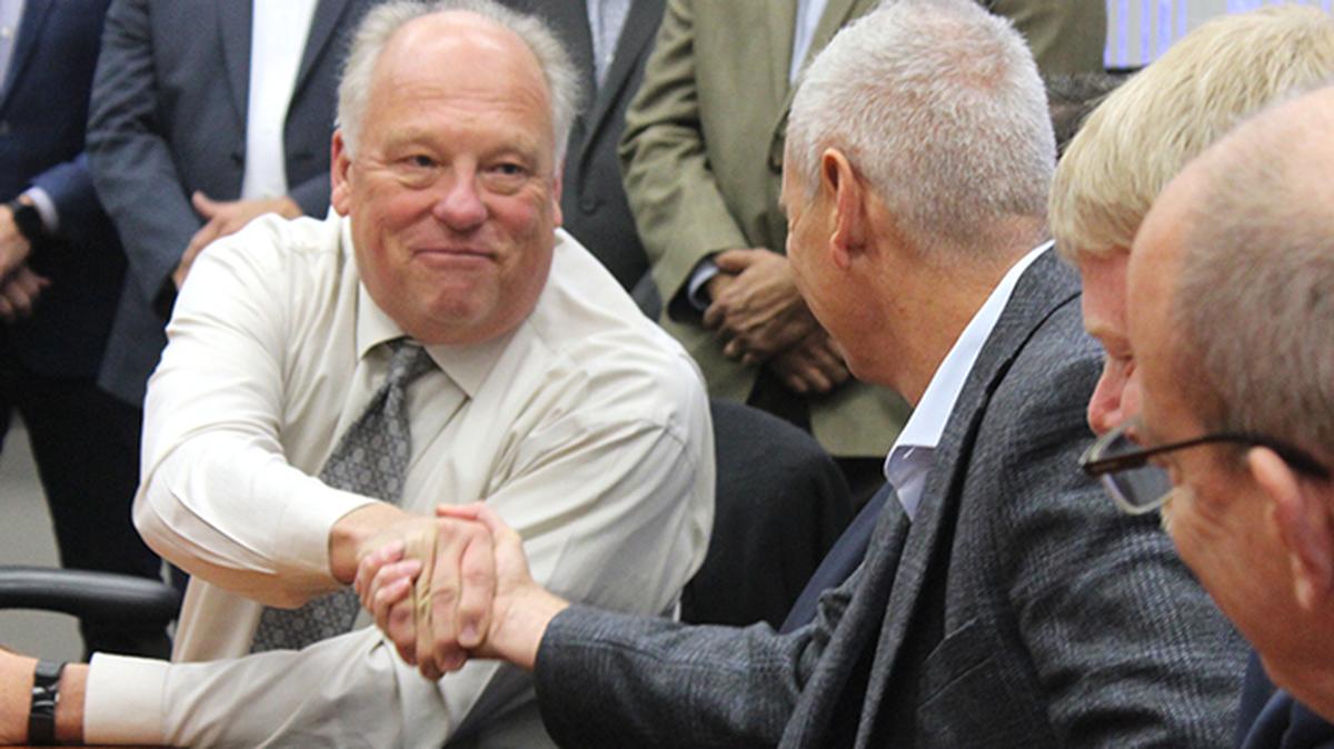 Lordstown Mayor Arno Hill, left, shakes hands with Steve Burns, Lordstown Motors Corp. CEO, during a media event Thursday, Nov. 14, 2019, at the former General Motors Lordstown Assembly Complex.