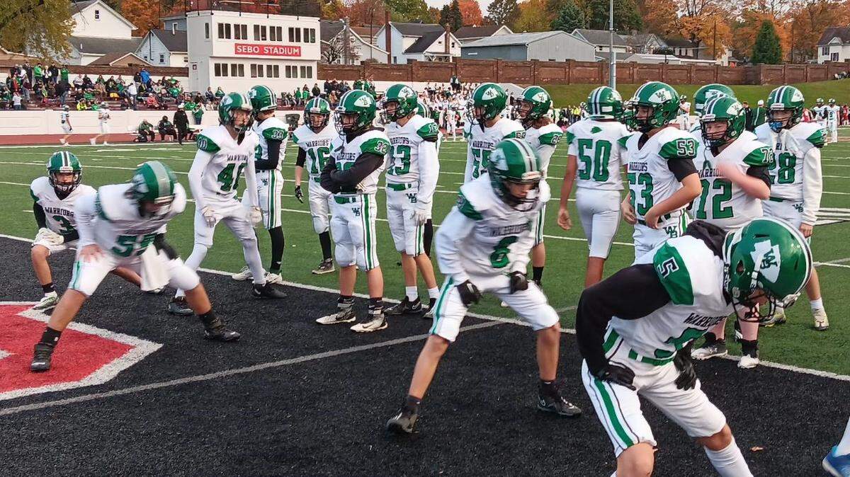 West Branch players warm up prior to Friday night’s rivalry game at Salem.
