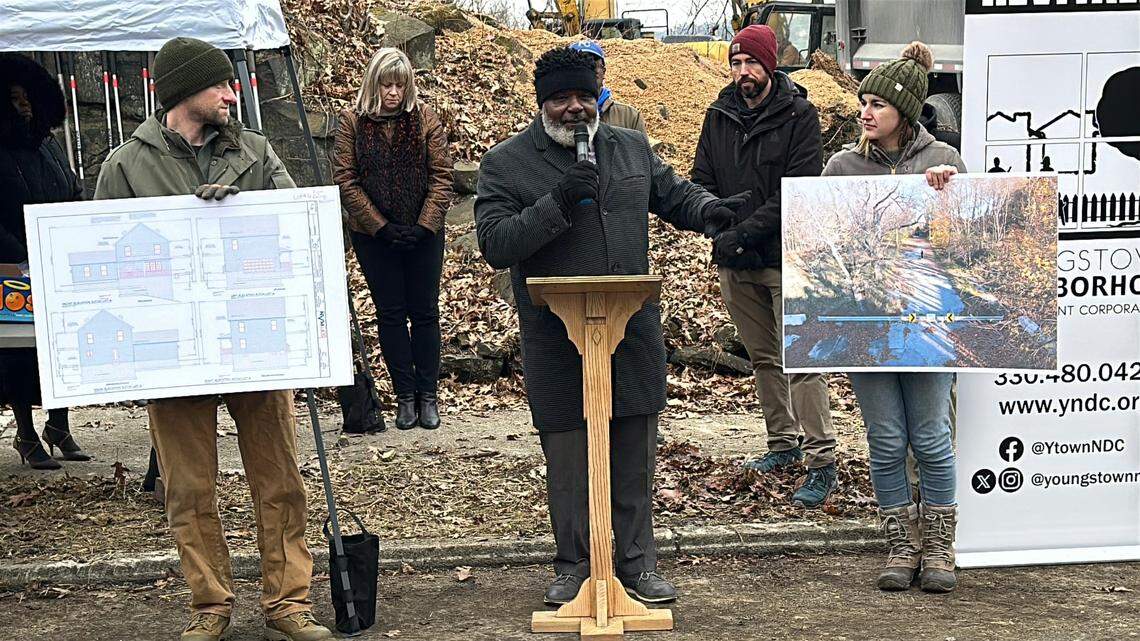 Mayor Jamael Tito Brown (center) celebrated the first phase of a major revitalization project, which included building three new homes and clearing of more than 500 cubic yards of debris on Bernard Street.