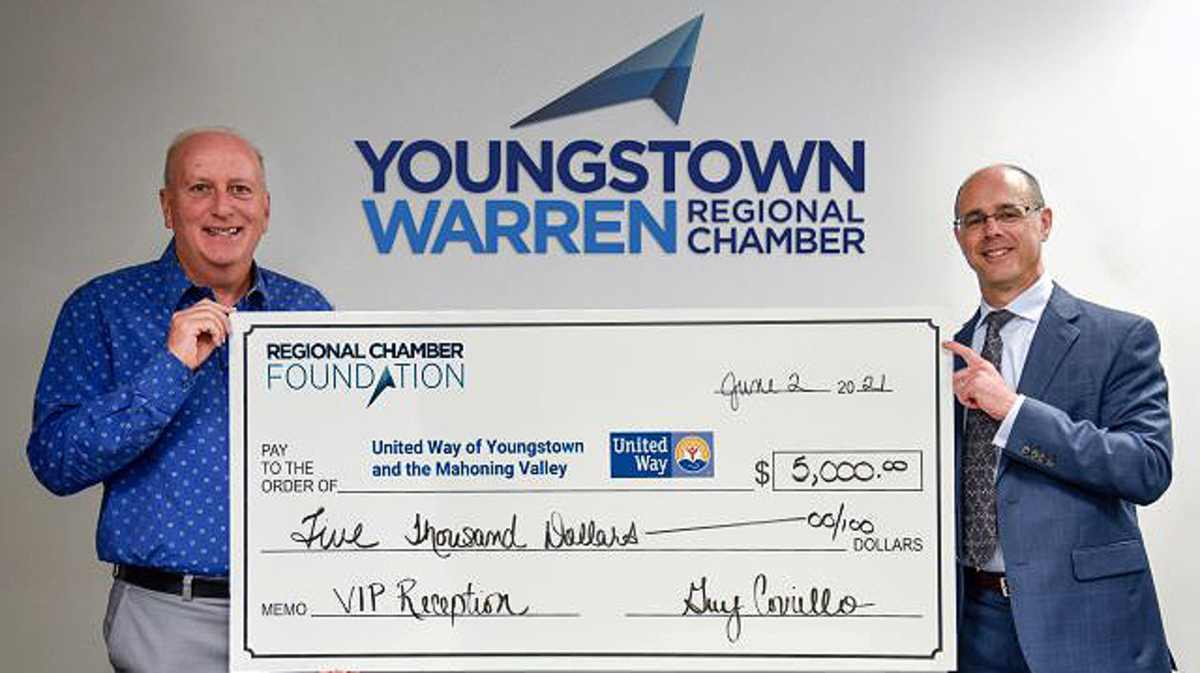 Guy Coviello, right, Youngstown/Warren Regional Chamber president and CEO, presents a $5,000 check to Bob Hannon, president of the United Way of Youngstown and the Mahoning Valley. (Contributed photo)