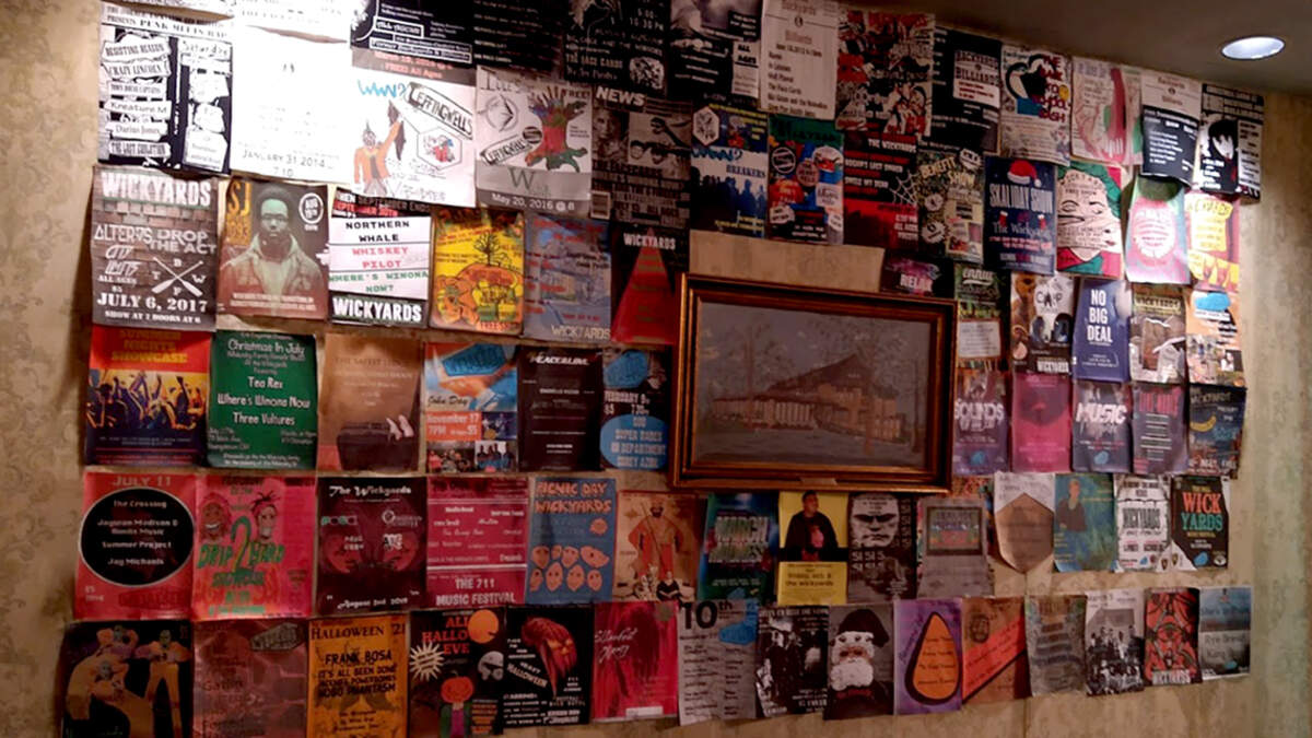 A wall of flyers from concerts at The Wickyards in Youngstown, Ohio.