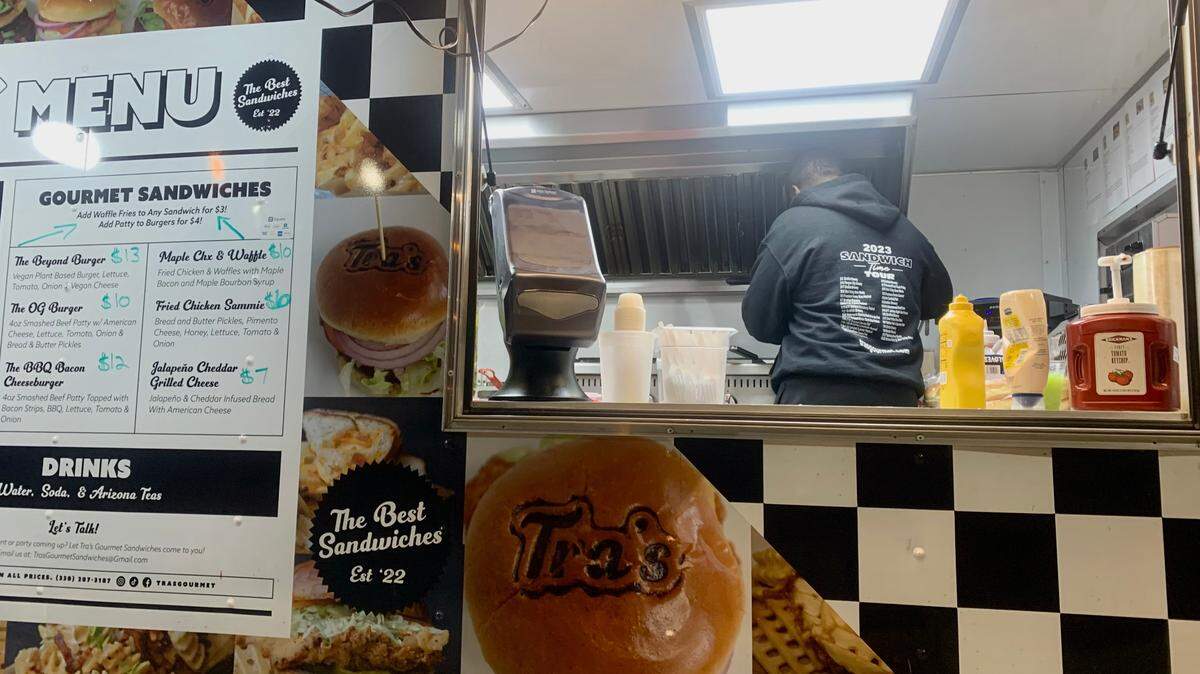 Grabbing a late-night bite from Tra’s Gourmet Sandwiches food truck