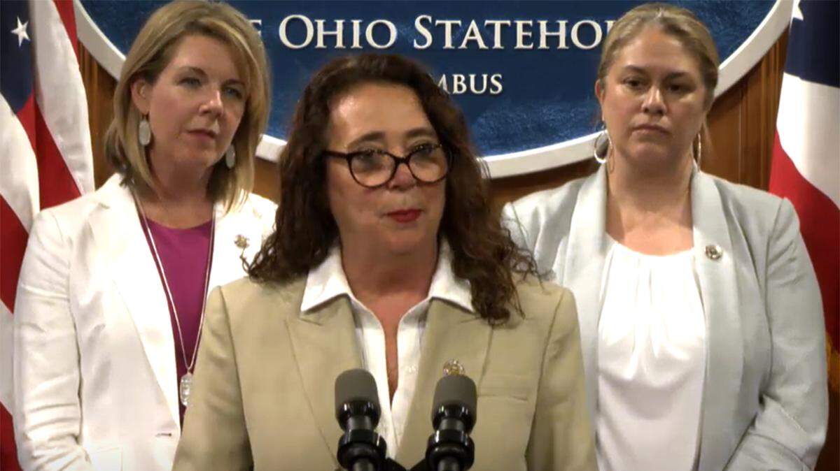 State Rep. Michele Lepore-Hagan of Youngstown, D-58th, speaks to reporters during a media briefing on a proposed constitutional amendment to protect abortion rights in Ohio on Tuesday, May 17, 2022. At left is Ohio House Minority Leader Allison Russo. At right is Democratic state Rep. Monique Smith of Fairview Park.