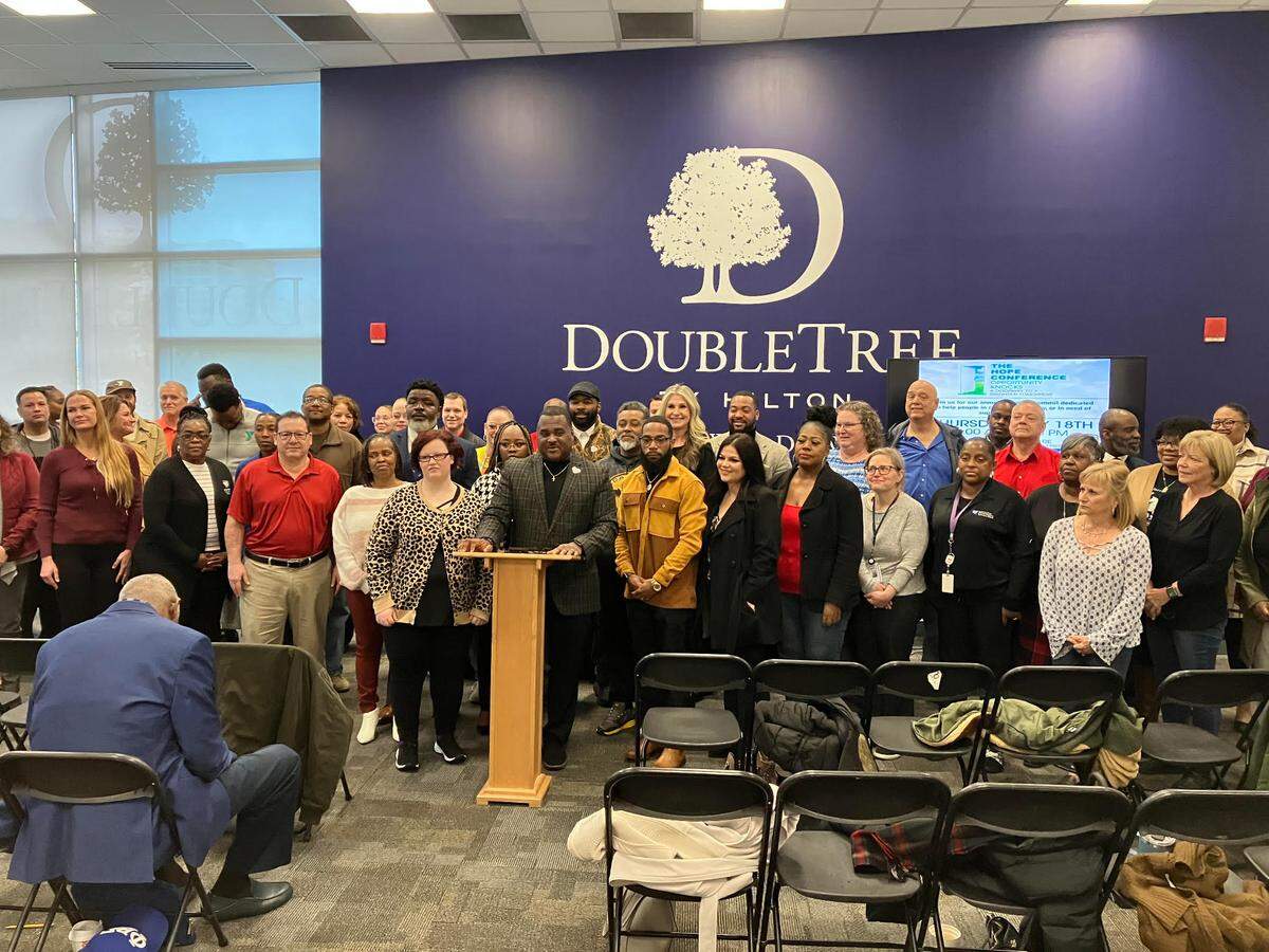 Guy Burney, the director of the Community Initiative to Reduce Violence (CIRV), talks with city, county and state officials about the upcoming Hope Conference in Youngstown.