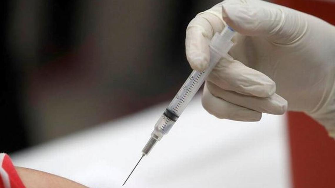 A review of nearly 75 million COVID-19 patient records from around the globe found that those who received a flu vaccine up to six months before getting infected were less likely to have a stroke, experience sepsis or develop blood clots caused by the disease. (LM Otero | AP Photo, File)