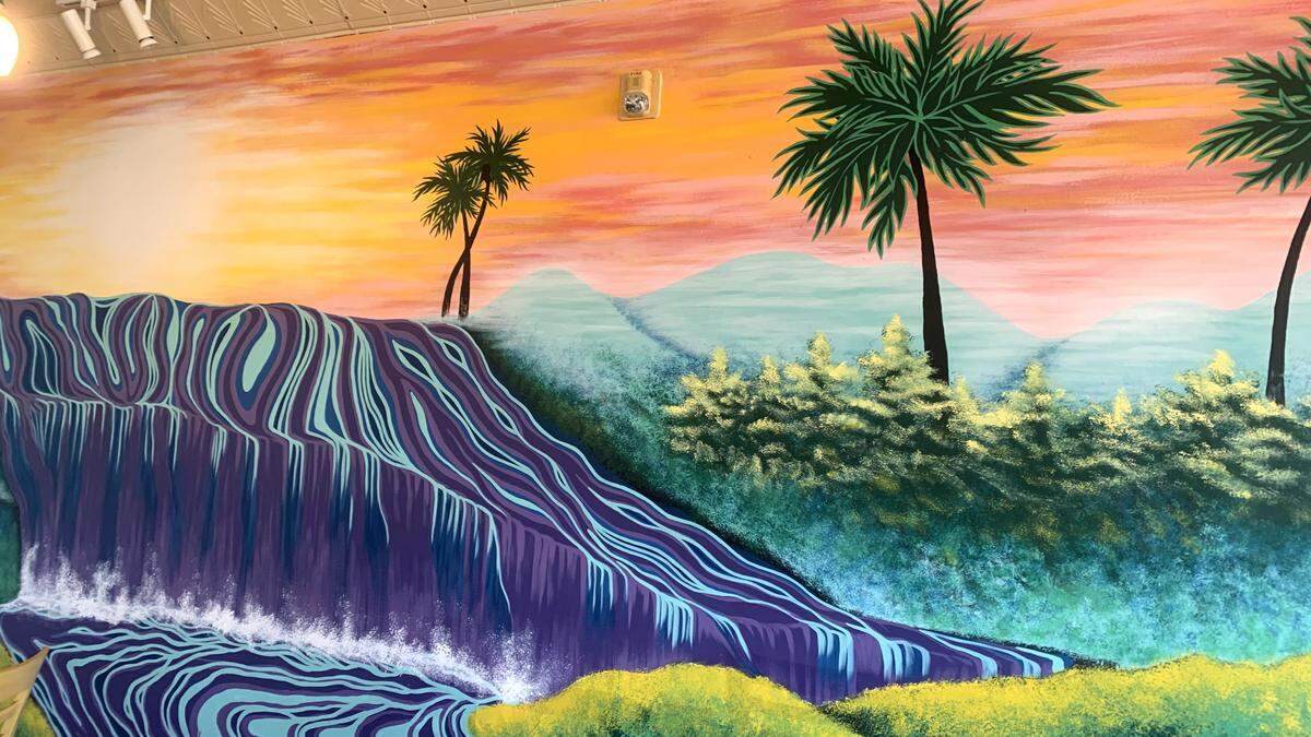Mural inside Tebo’s Caribbean Cuisine painted by Cleveland artist Victoria Hollar.