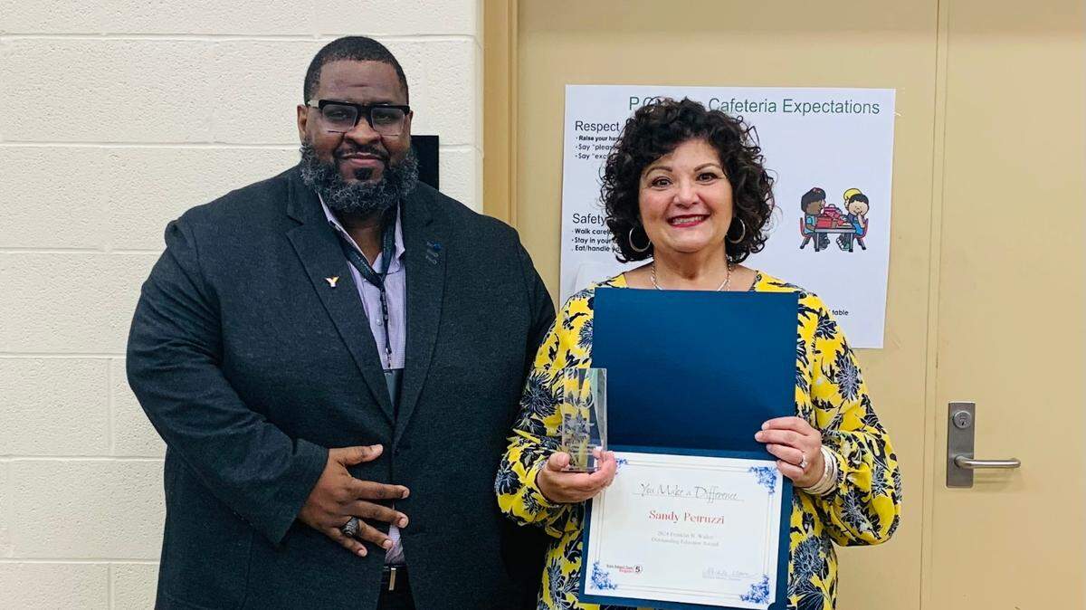 YCSD Superintendent Jeremy Batchelor with the Franklin B. Walter Outstanding Educator Award winner, Sandy Petruzzi.