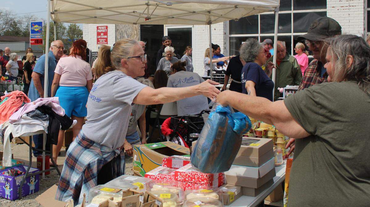 Workers handing out food at Faith Fellowship’s food pantry.