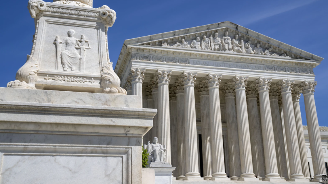 FILE - People stand on the steps of the U.S. Supreme Court, Feb.11, 2022, in Washington. The Supreme Court has agreed to take up a dispute over a medication used in the most common method of abortion in the United States. It’s the court’s first abortion case since it overturned Roe v. Wade last year.