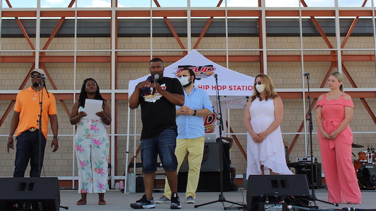 City Council President DeMaine Kitchen speaks about the resolution to declare racism as a public health crisis. From left are Council members Julius Oliver, 1st Ward; Samantha Turner, 3rd Ward; Mike Ray, 4th Ward;  Lauren McNally, 5th Ward; and  Basia Adamczak, 7th Ward. (Photo by Ellen Wagner)
