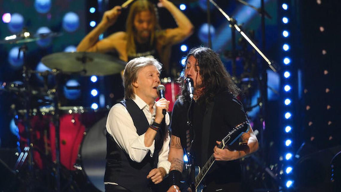 Paul McCartney and Dave Grohl perform "Get Back" during the Rock & Roll Hall of Fame induction ceremony, Sunday, Oct. 31, 2021, in Cleveland. 