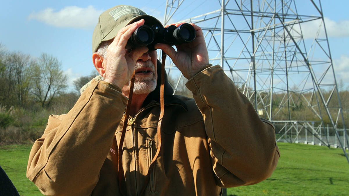 Richard Rook, a 33-year employee at the former Niles Generating Station along Belmont Avenue in Weathersfield Township watches as the structure is demolished on Thursday, April 28, 2022. He said he was “sad to see it go.”