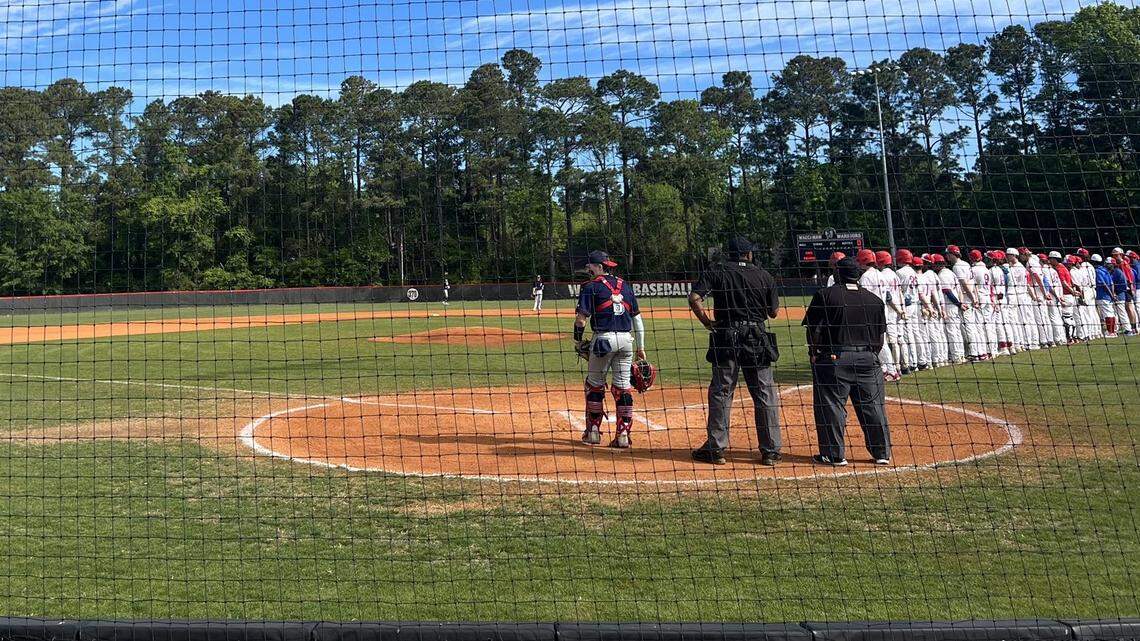 Players stand for the National Anthem before Austintown Fitch played Princess Ann on Thursday.