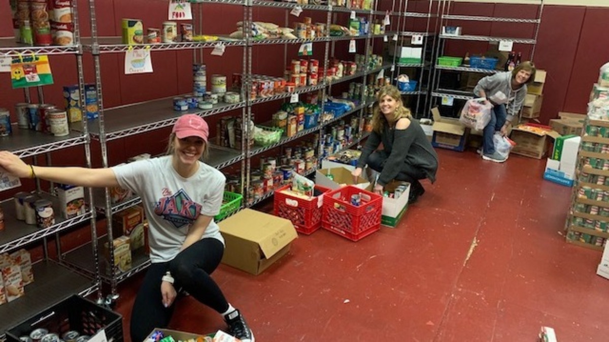 Boardman Center Intermediate School counselors Kendra Baltes, Mindy DePietro and Linda Frease pack a week’s worth of groceries from the school pantry for families who depend on the pantry when school is in session. 