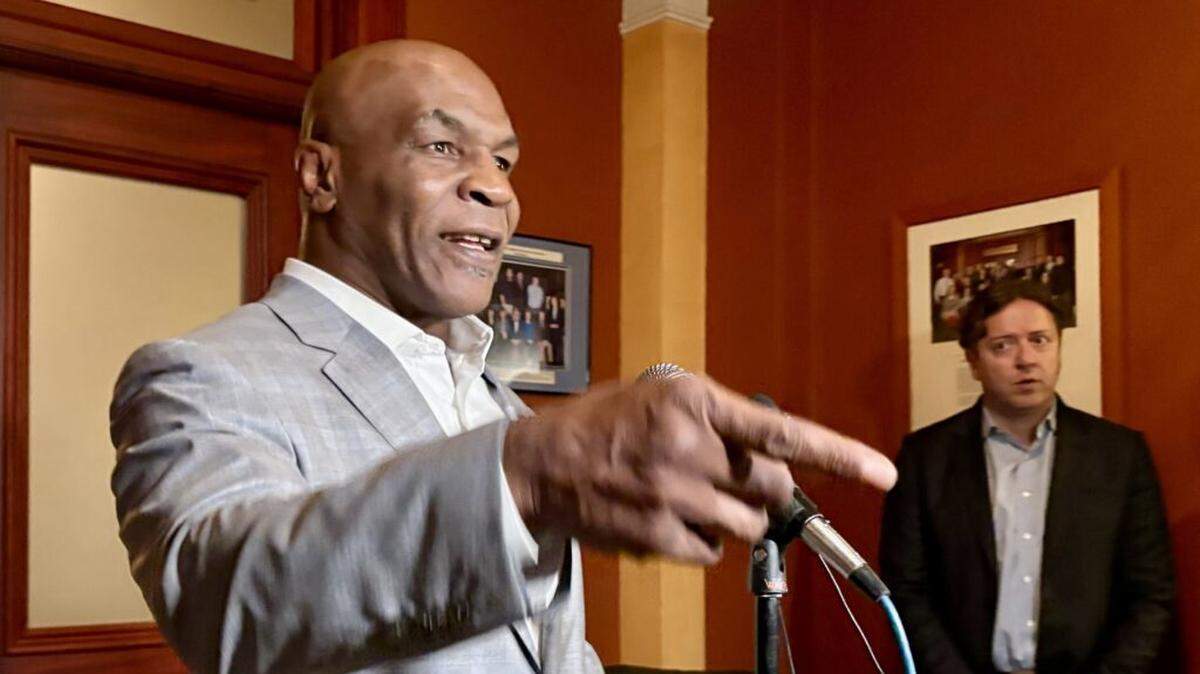 Former heavyweight champion boxer Mike Tyson speaks to reporters at the Pennsylvania Capitol on Wednesday.