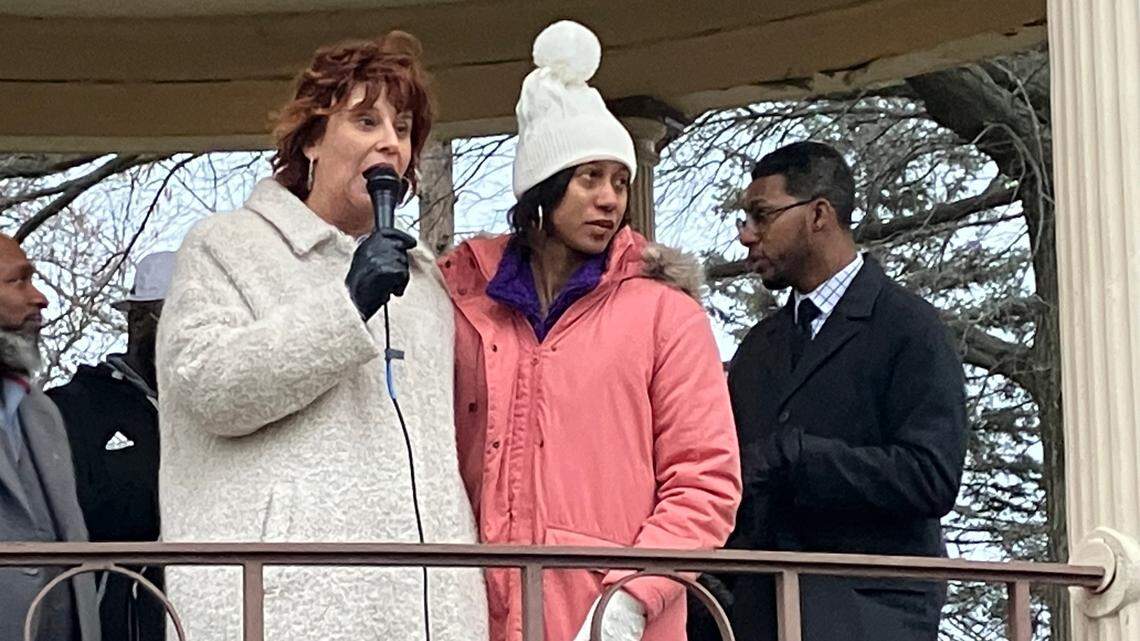 Brittany Watts, right, stands with her attorney during a rally supporting her Thursday afternoon at Warren Courthouse Square.