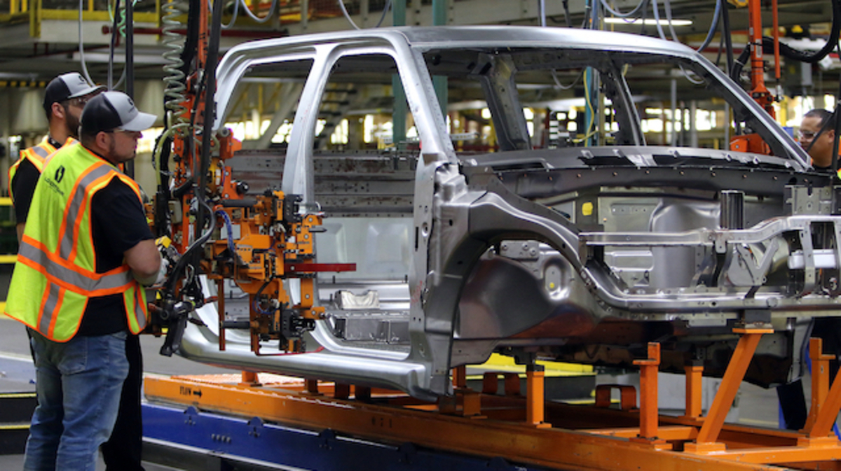workers Adjusting the machine that puts on the hinges 

Lordstown Motors as they start production of the Endurance Electric Pick-up Truck is having a week long open house for media, investors, and buyers of the new truck being built at the former GM Lordstown facility ! 
