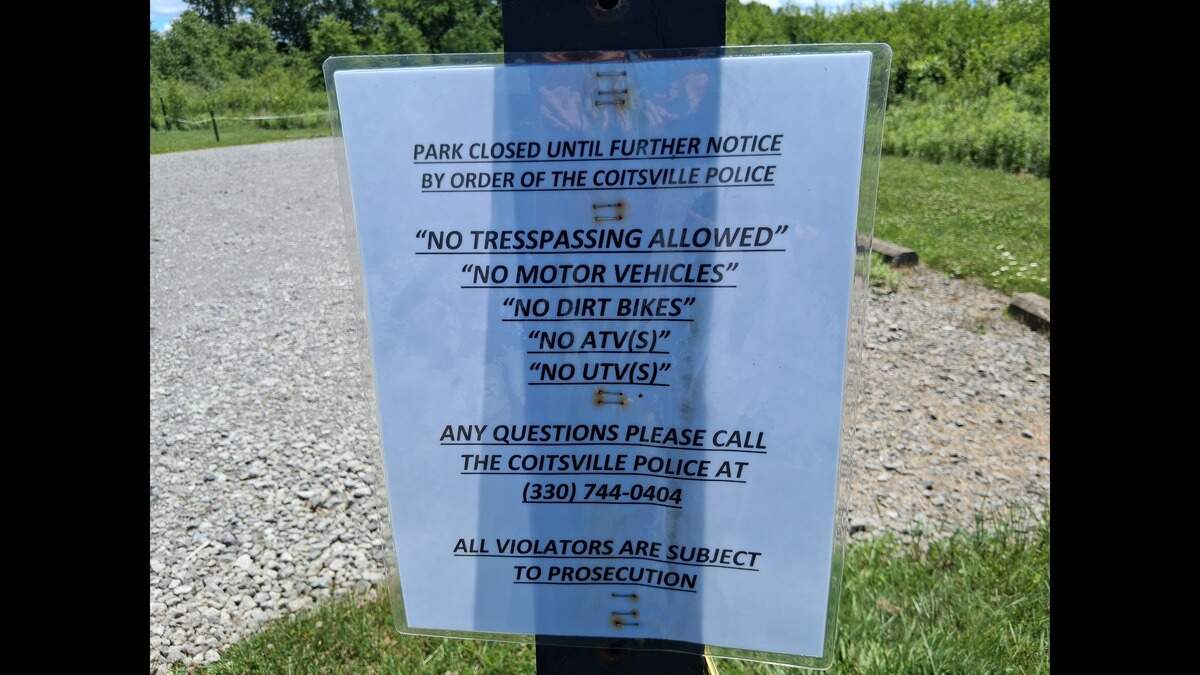 A sign posted by Coitsville Township states the park is closed until further notice.