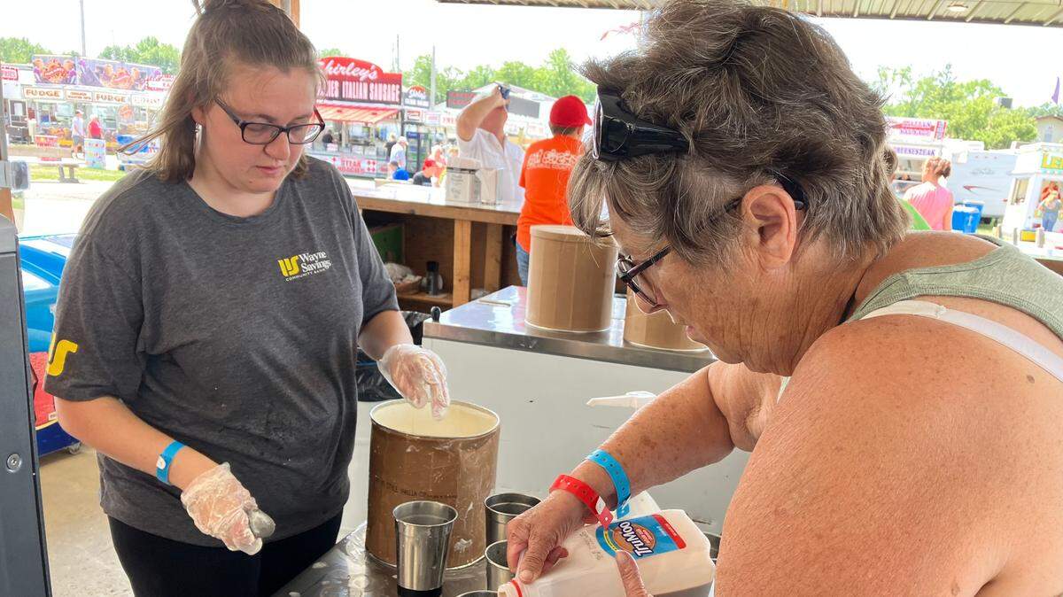 Workers work on milkshakes at the Trumbull County Fair.