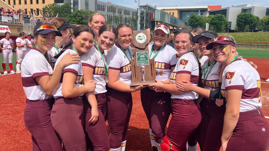 South Range softball players pose with the state runner-up trophy after a 5-3 loss to Liberty Union in the state championship softball game.