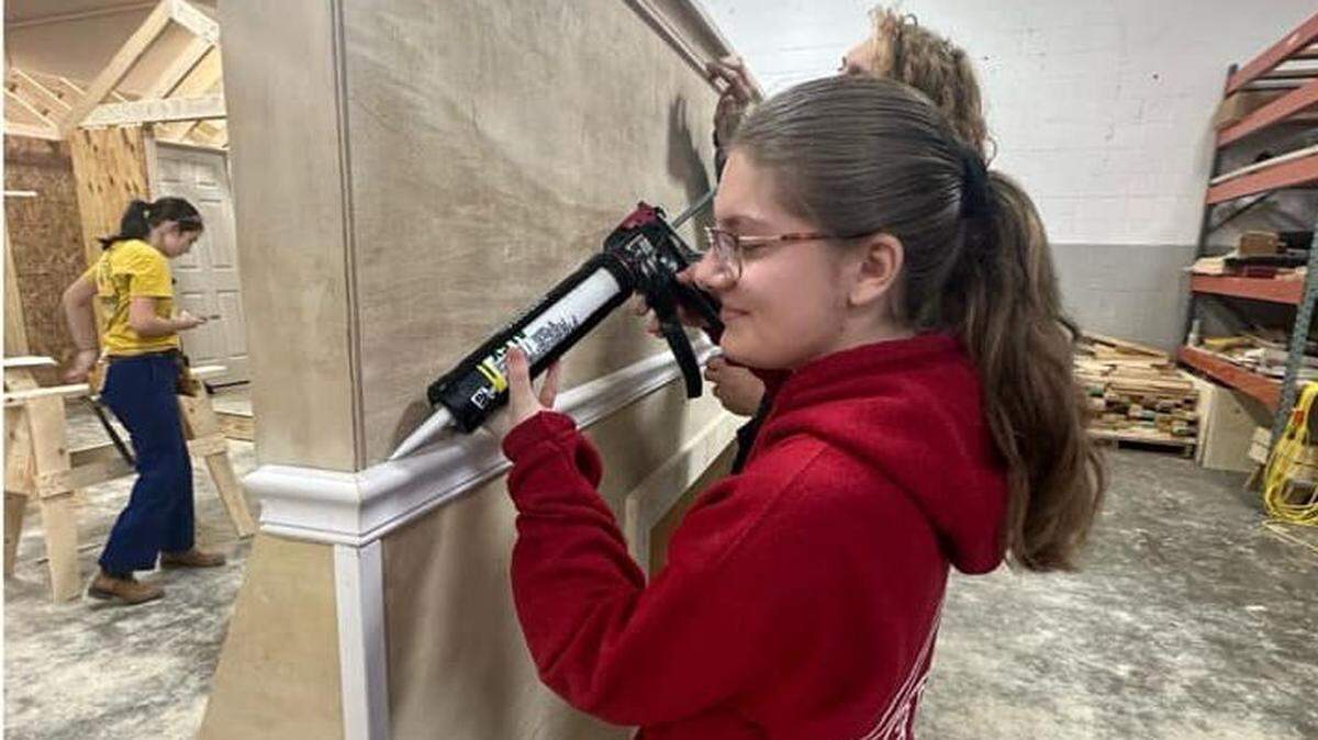 MCCTC students studying construction and welding crafted a backdrop fireplace for the Mahoning County Board of Developmental Disabilities’ Kristmas at Kirtz.