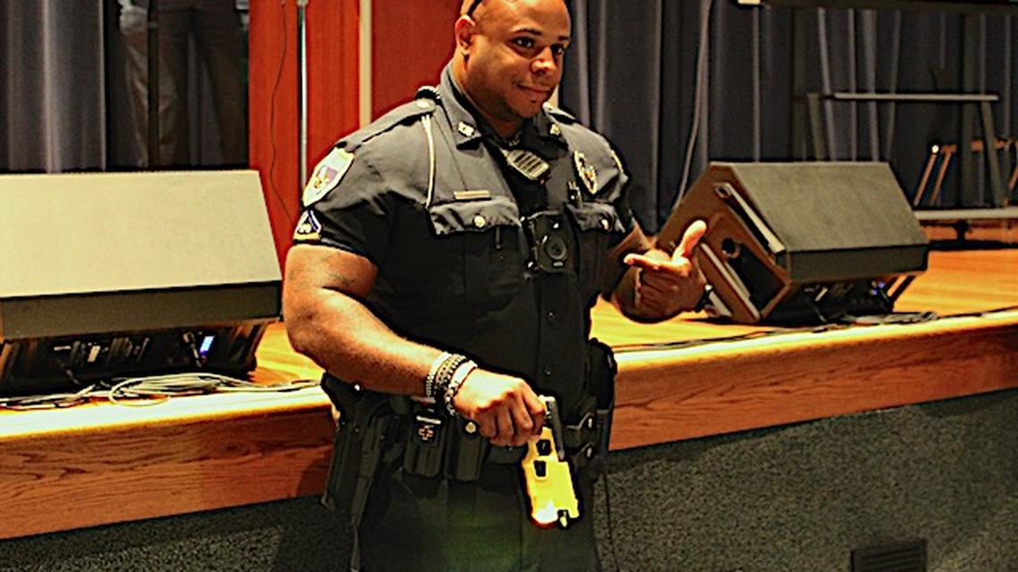 Youngstown Police Department Officer Ryan Curry demonstrates how the Axon Body 3 camera activates when he uses his electronic stun device. (Ellen Wagner | Mahoning Matters)