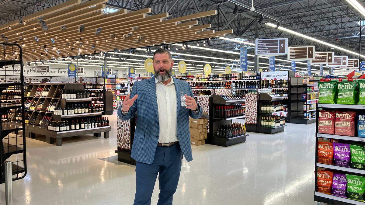 Meijer Store Director Patrick Hughes talks about the new Meijer store in Warren. In this picture, he’s standing in front of the store’s alcohol section. 