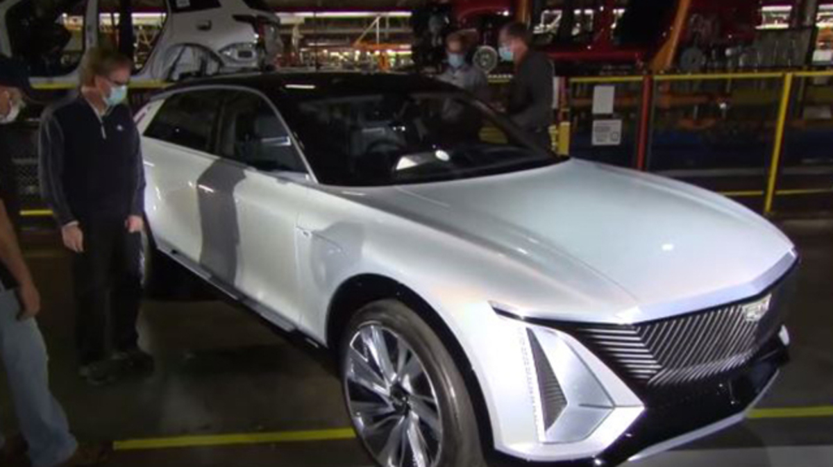 General Motors representatives eye the new all-electric Cadillac LYRIQ, which the automaker announced Tuesday. The vehicle will be powered by battery cells to be made in Lordstown and will likely be built by some former GM Lordstown workers. (Photo provided)
