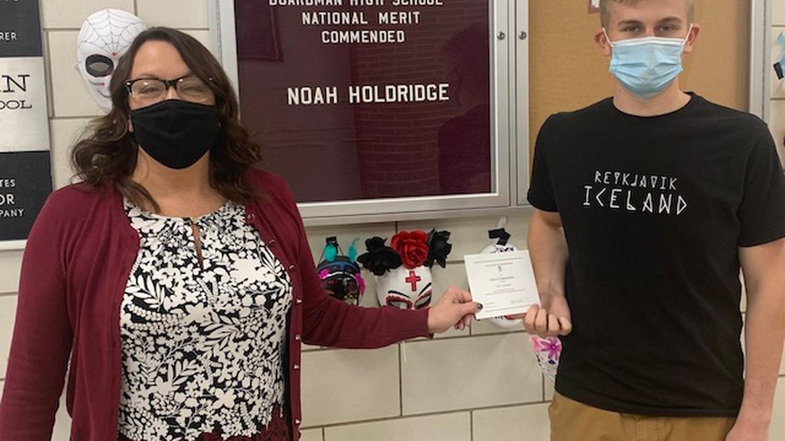 Boardman senior Noah Holdridge has received recognition from the National Merit Scholarship Corporation. Presenting him with the honor is Cynthia Fernback, Boardman High School principal. (Contributed by Boardman Schools)