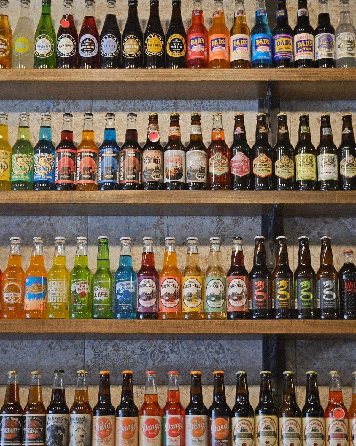 When customers come inside Kast Iron Soda Works, they’ll see 550 varieties of glass bottled soda on the wall of the screen-free soda shop in Salem.&nbsp;