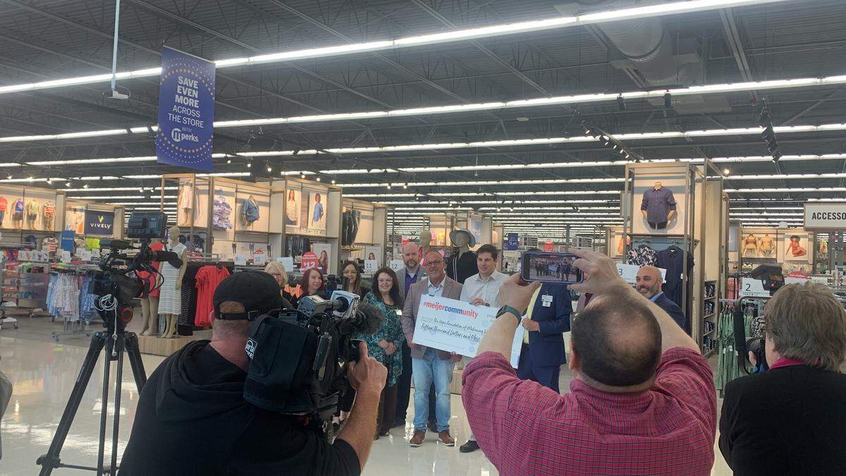 Leading up the grand opening of the store in Austintown, Meijer presented a $15,000 donation to Anthony Spano, founder and executive director of The Hope Foundation.