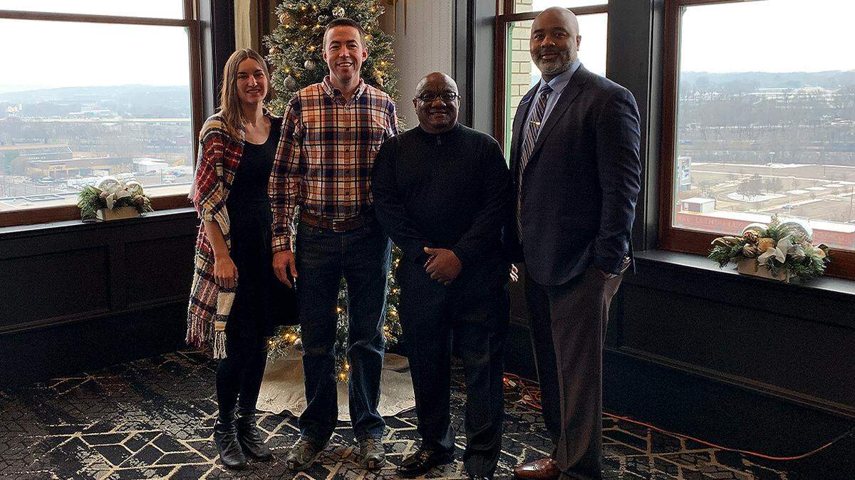 From left are Tiffany Sokol, Youngstown Neighborhood Development Corporation housing director; Ian Beniston, YNDC executive director; Lee Fields, community development officer at Premier Bank; and Reginald Temple, vice president and director of community development at Premier Bank.