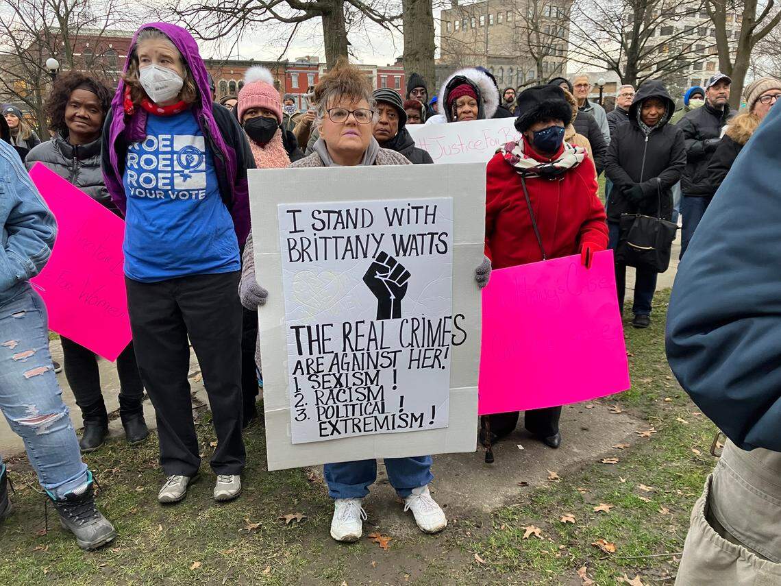 A Brittany Watts supporter holds a sign at a rally for her Thursday afternoon at Warren Courthouse Square.