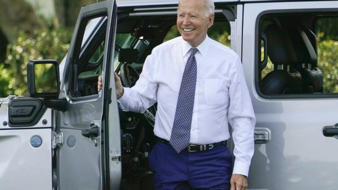 President Joe Biden smiles after driving a Jeep Wrangler 4ex Rubicon on the South Lawn of the White House in Washington on Thursday during an event on clean cars and trucks. (Susan Walsh | AP Photo)
