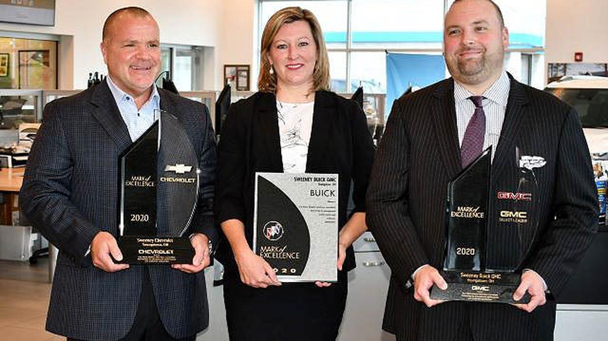 Sweeney Chevrolet and Sweeney Buick GMC received General Motors’ 2020 Mark of Excellence award. GM executives presented the awards Thursday. From left are Bobby Stackhouse, Sweeney Chevy executive manager; Alexa Sweeney Blackann, president of Sweeney Chevrolet Buick GMC; and Derek Snyder, Sweeney Buick GMC executive manager. (Contributed photo)