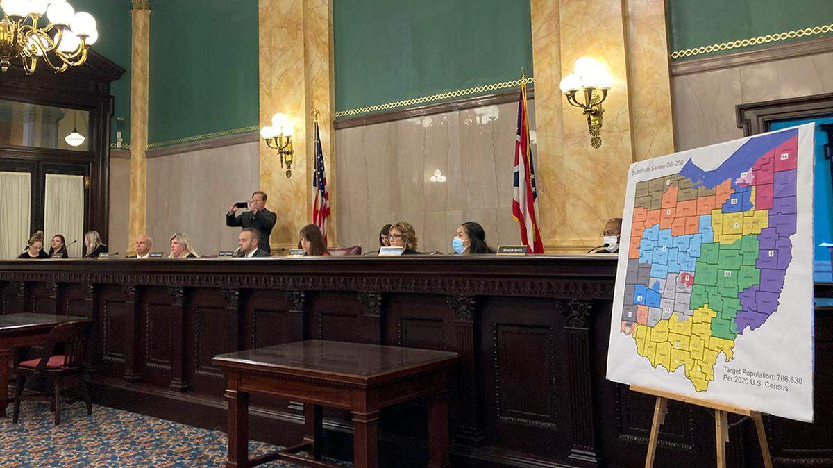 FILE — Members of the Ohio Senate Government Oversight Committee hear testimony on one of the new maps of state congressional districts in this file photo from Nov. 16, 2021, at the Ohio Statehouse in Columbus, Ohio. Accusations have flown for months over whose delays are most to blame for Ohio’s redistricting predicament, a mess of a political mapmaking fight that’s left the state with unsettled political boundaries and no date for its Statehouse primaries.